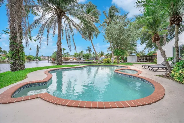 a view of a swimming pool with a garden
