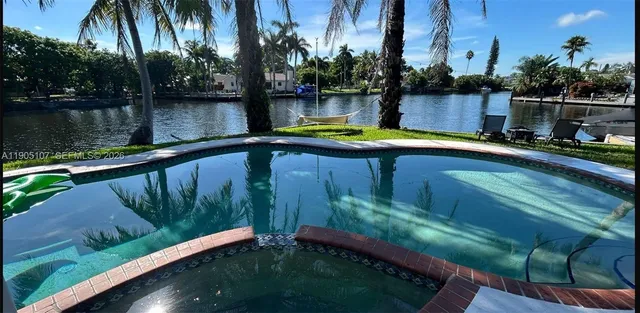 a view of swimming pool with a yard