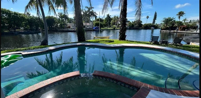 a view of swimming pool with a yard