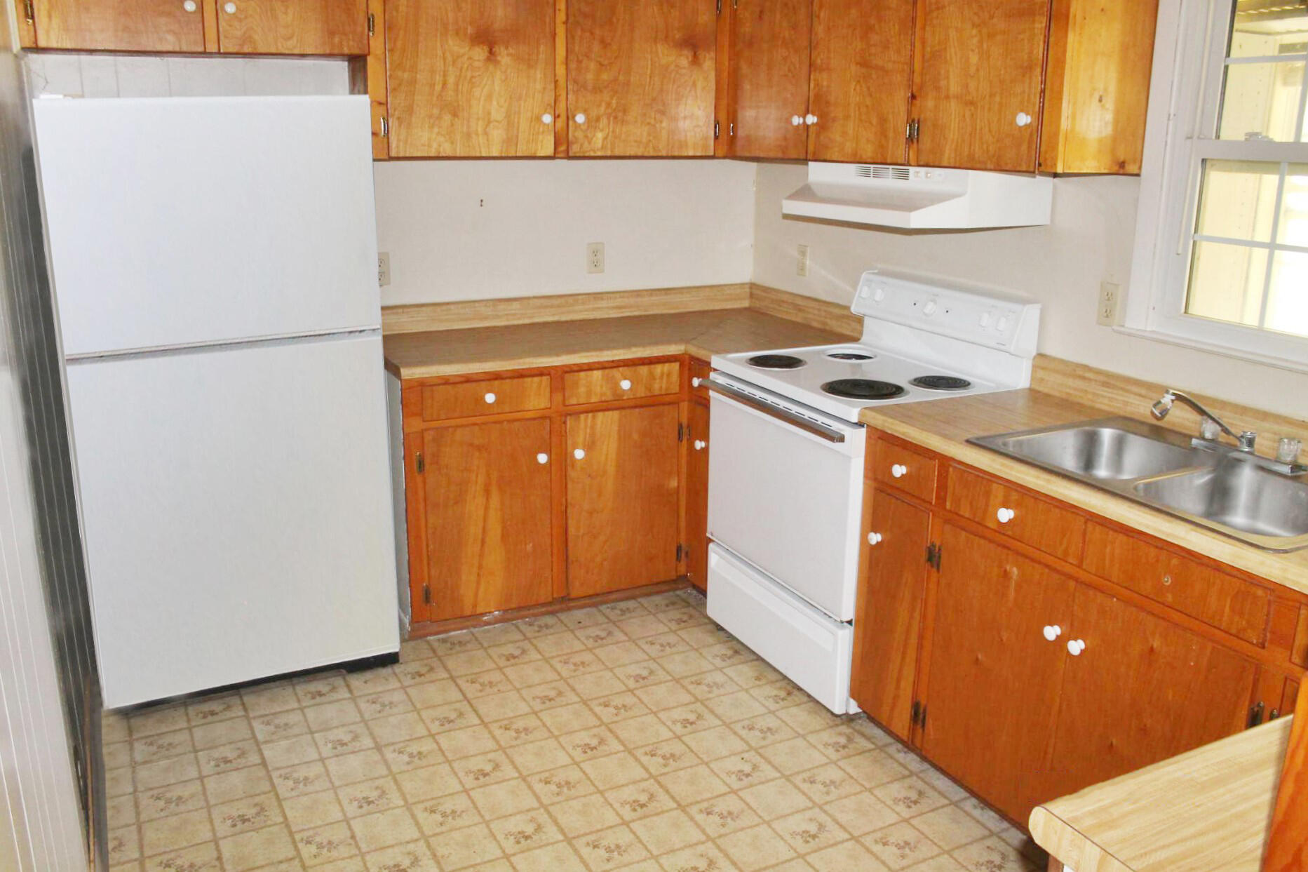 1062 Quartz Road Blue Ridge, VA 24064 - Photo 14 of 26 a kitchen with a refrigerator and a stove
