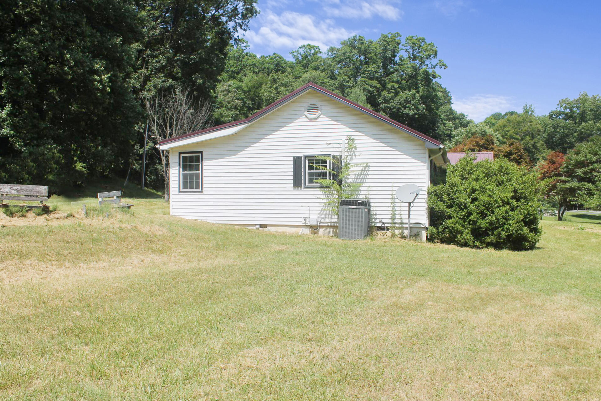 1062 Quartz Road Blue Ridge, VA 24064 - Photo 4 of 26 a view of a house with a yard and garage