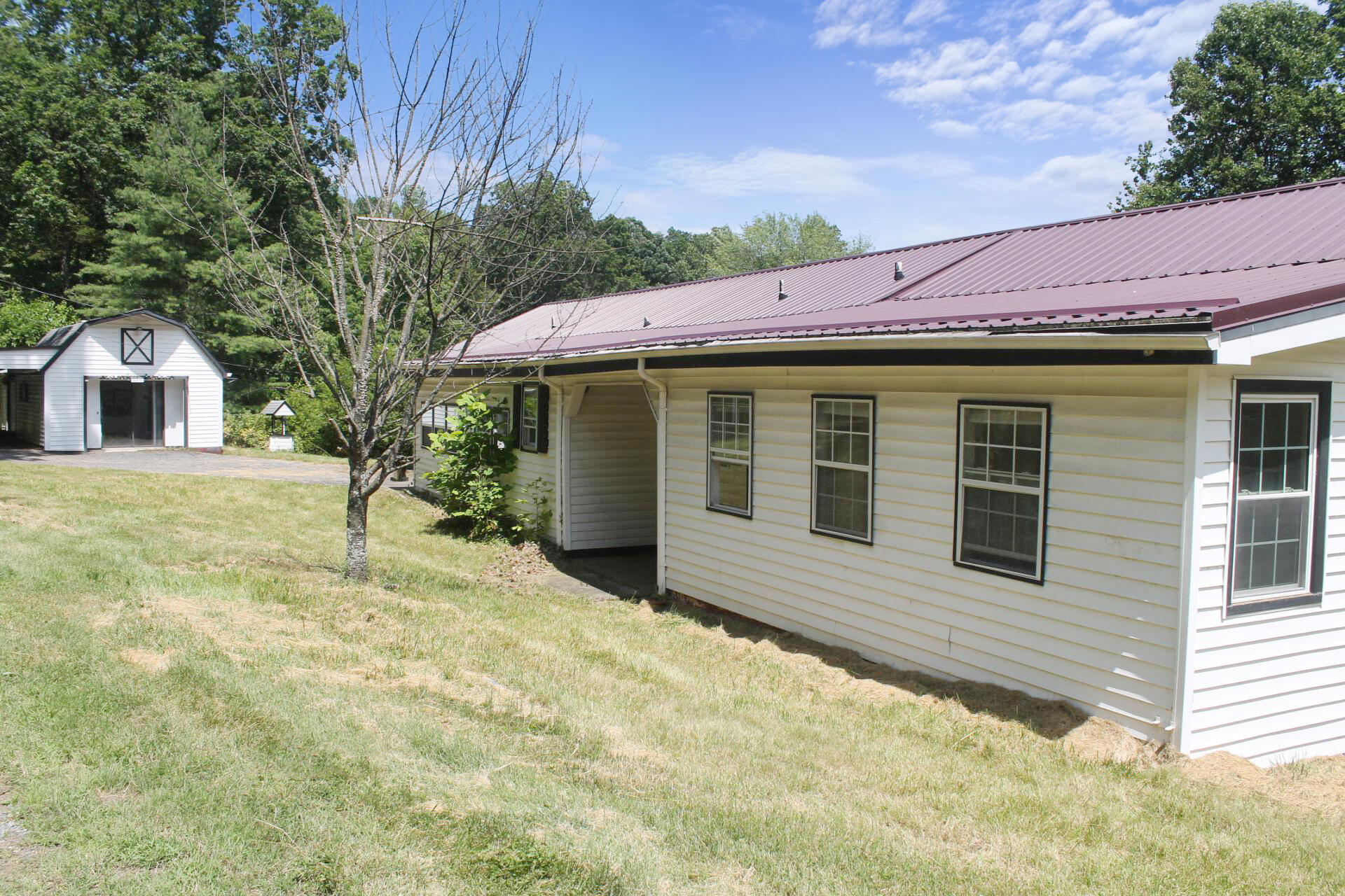1062 Quartz Road Blue Ridge, VA 24064 - Photo 5 of 26 a front view of a house with a yard and garage