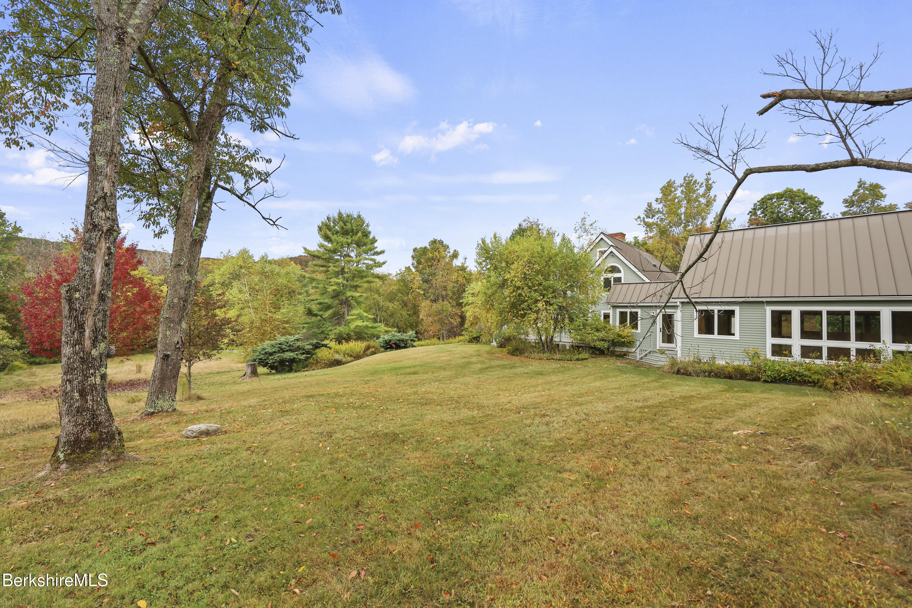 1030 Simonds Road Williamstown, MA 01267 - Photo 68 of 76 a view of a house with a yard and a large tree