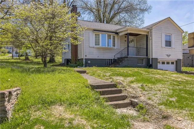a view of a house with a swimming pool