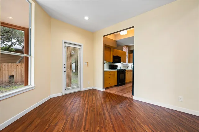 a view of a kitchen cabinets and wooden floor