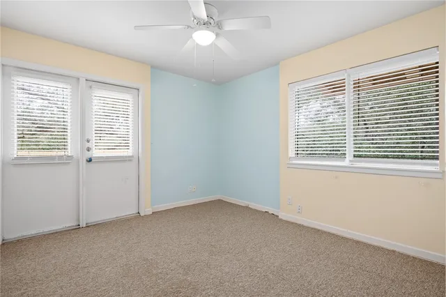 a view of an empty room with a window