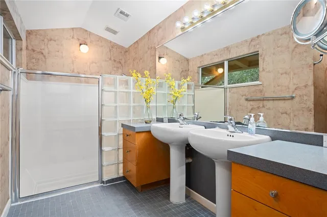 a kitchen with a sink and a refrigerator