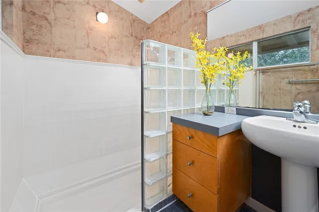 a bathroom with a sink and a mirror