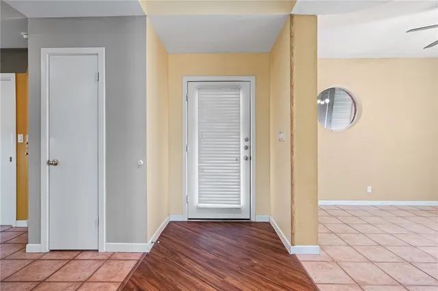 a view of room with window and wooden floor
