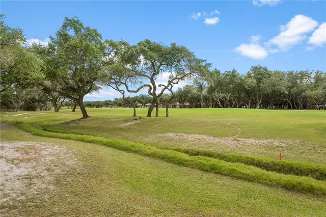 a view of a golf course with a lake