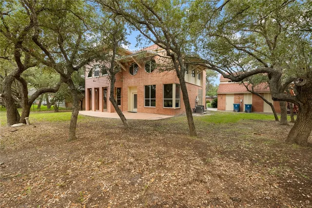 a house with trees in front of it