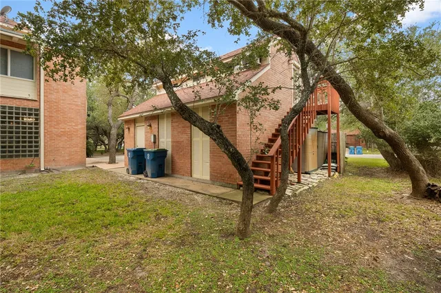 a house that has tree in front of it