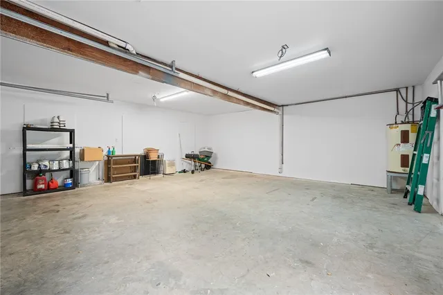 a view of a livingroom with storage and utility room
