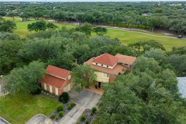 an aerial view of house with yard swimming pool and outdoor seating