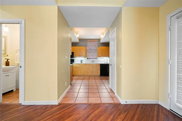 a view of a kitchen from the hallway