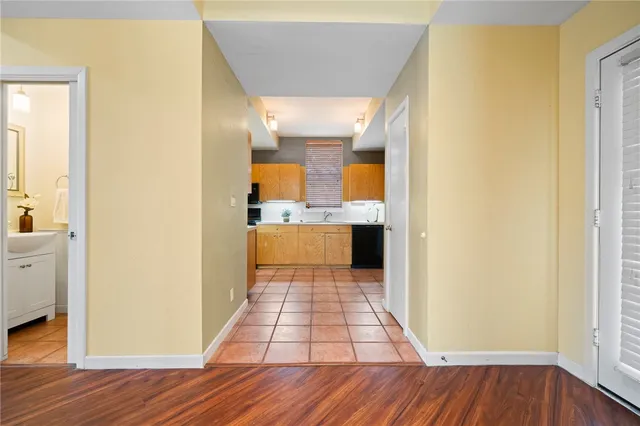 a view of a kitchen from the hallway