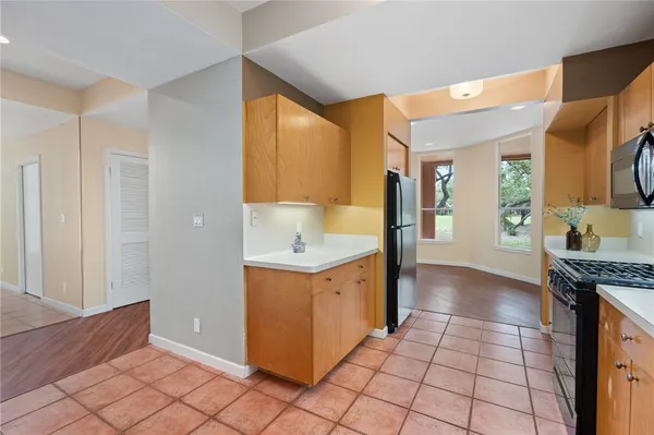 a kitchen with a stove a sink and a refrigerator