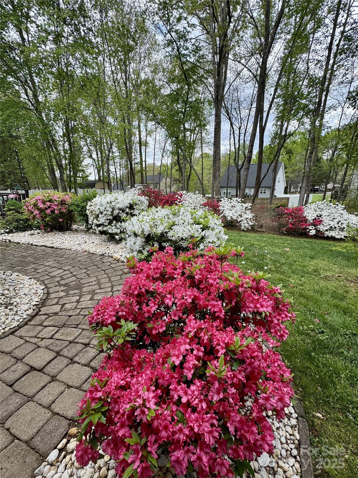 7176 Hunters Bluff Drive Denver, NC 28037 - Photo 31 of 36 a front view of a house with a yard and fountain