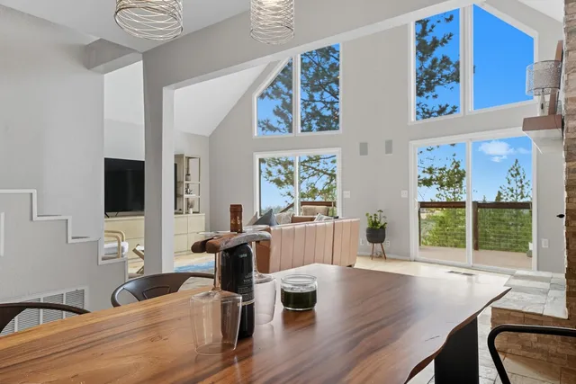 a view of a dining room with furniture window and outside view