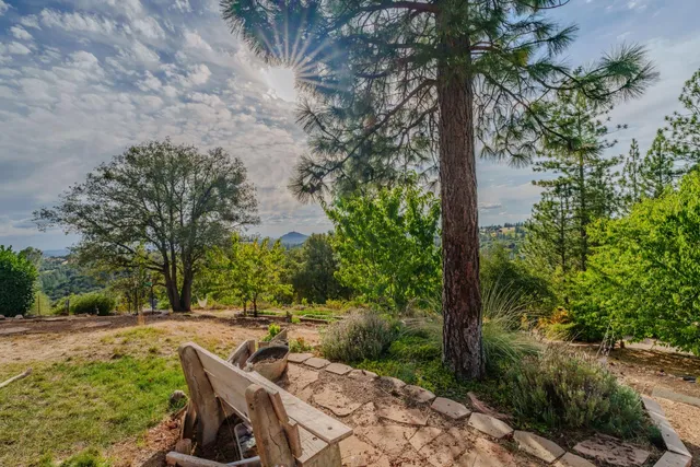 a kitchen with stainless steel appliances granite countertop a sink a stove and a microwave