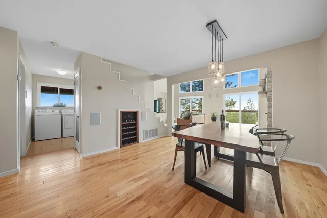 a view of a livingroom with a staircase and a living room