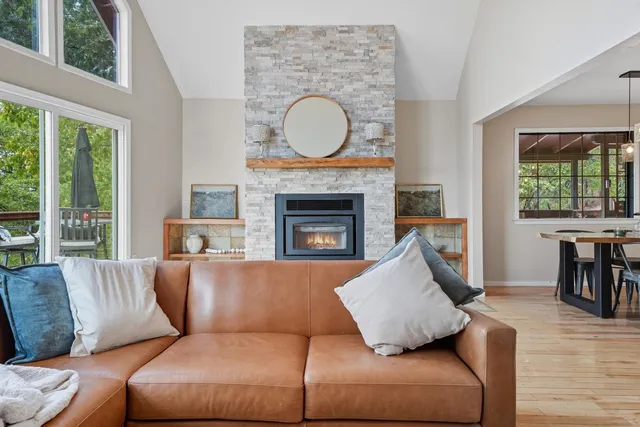 a view of a livingroom with workspace and a window