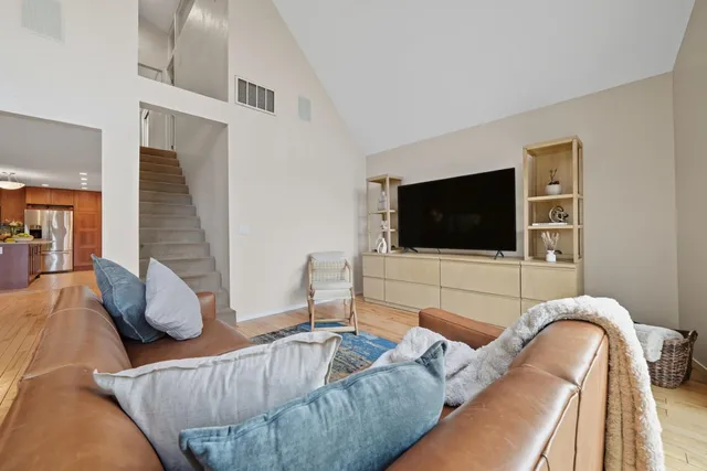 a bedroom with a bed and a lamp