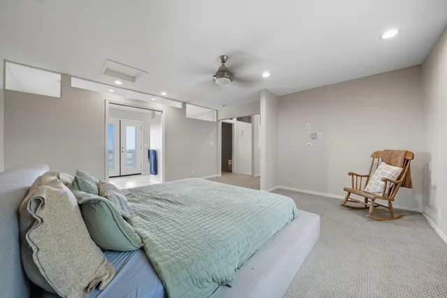 an aerial view of a house with a yard and lake view