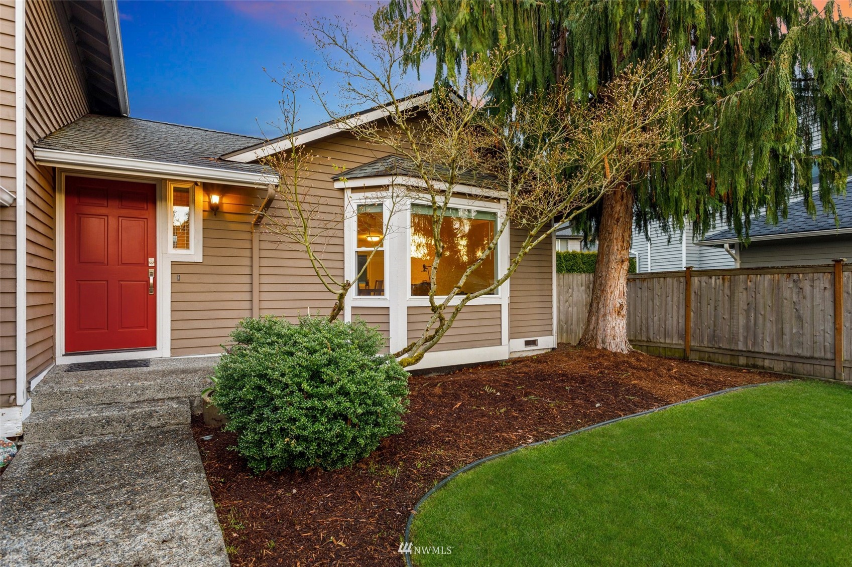 4805 Northeast 21st Street Renton, WA 98059 - Photo 2 of 40 a view of a backyard with plants and large trees