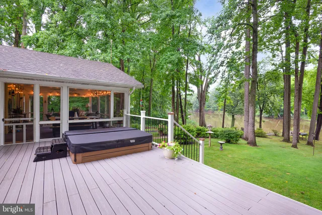 a kitchen with a sink a stove and chairs