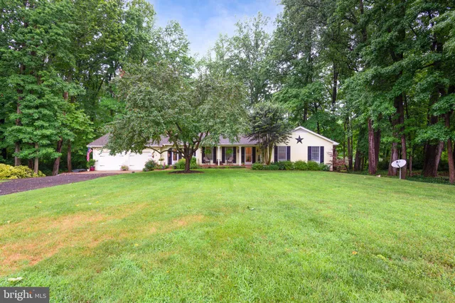 a kitchen with a stove a sink and a refrigerator