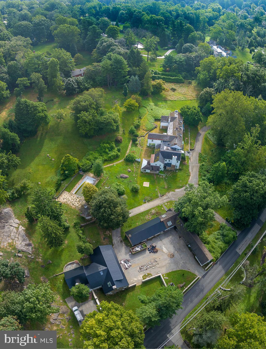 1425 Mt Pleasant Road Villanova, PA 19085 - Photo 2 of 5 an aerial view of a house with a garden and lake view