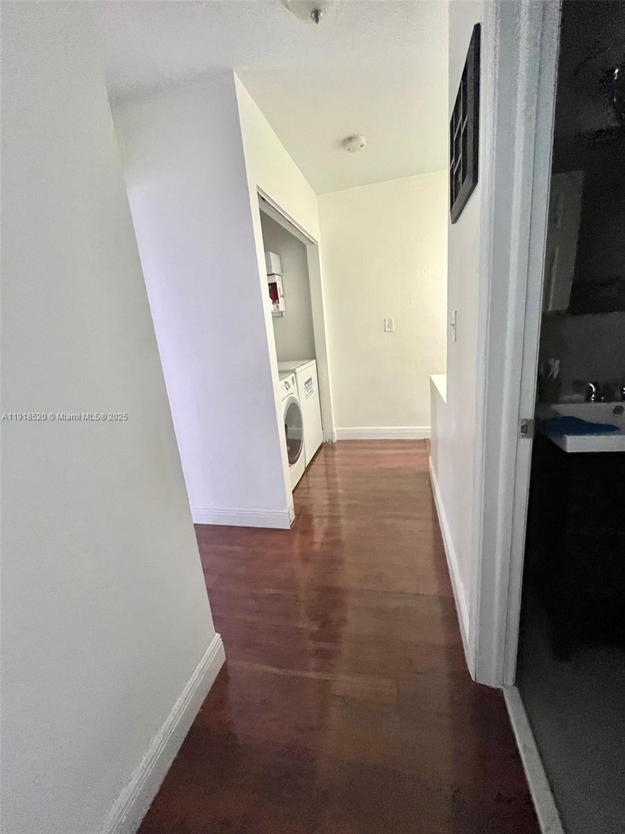 1990 Southwest 121st Court, Unit 232 Miami, FL 33175 - Photo 25 of 28 view of a hallway with wooden floor and entryway