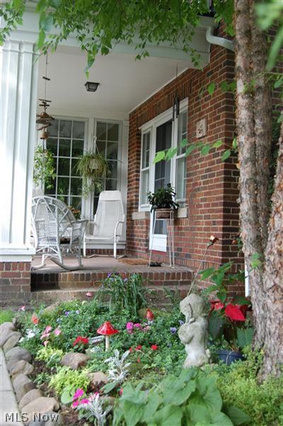 3107 Huntington Road Cleveland, OH 44120 - Photo 23 of 25 Side porch area with pretty gardens.