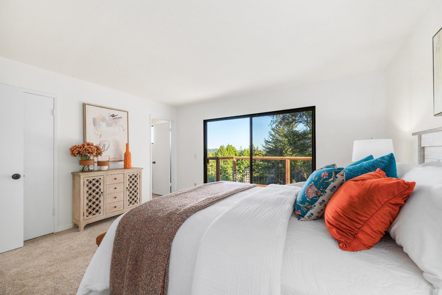 1130 Hidden Valley Road Soquel, CA 95073 - Photo 20 of 44 a bedroom with a bed and a large window