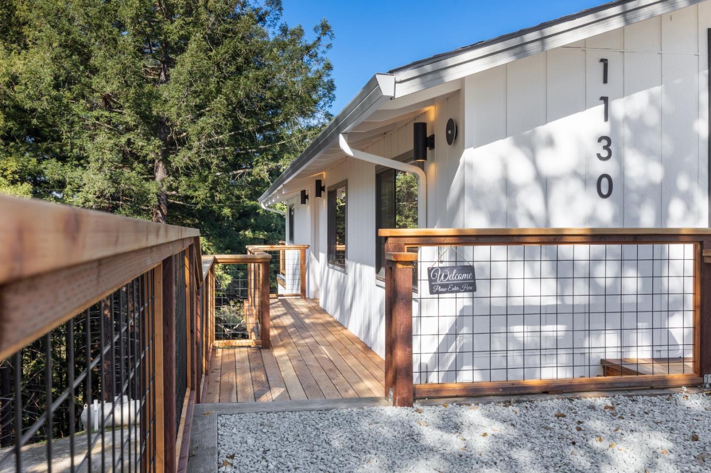 1130 Hidden Valley Road Soquel, CA 95073 - Photo 2 of 44 a view of a house with a wooden fence