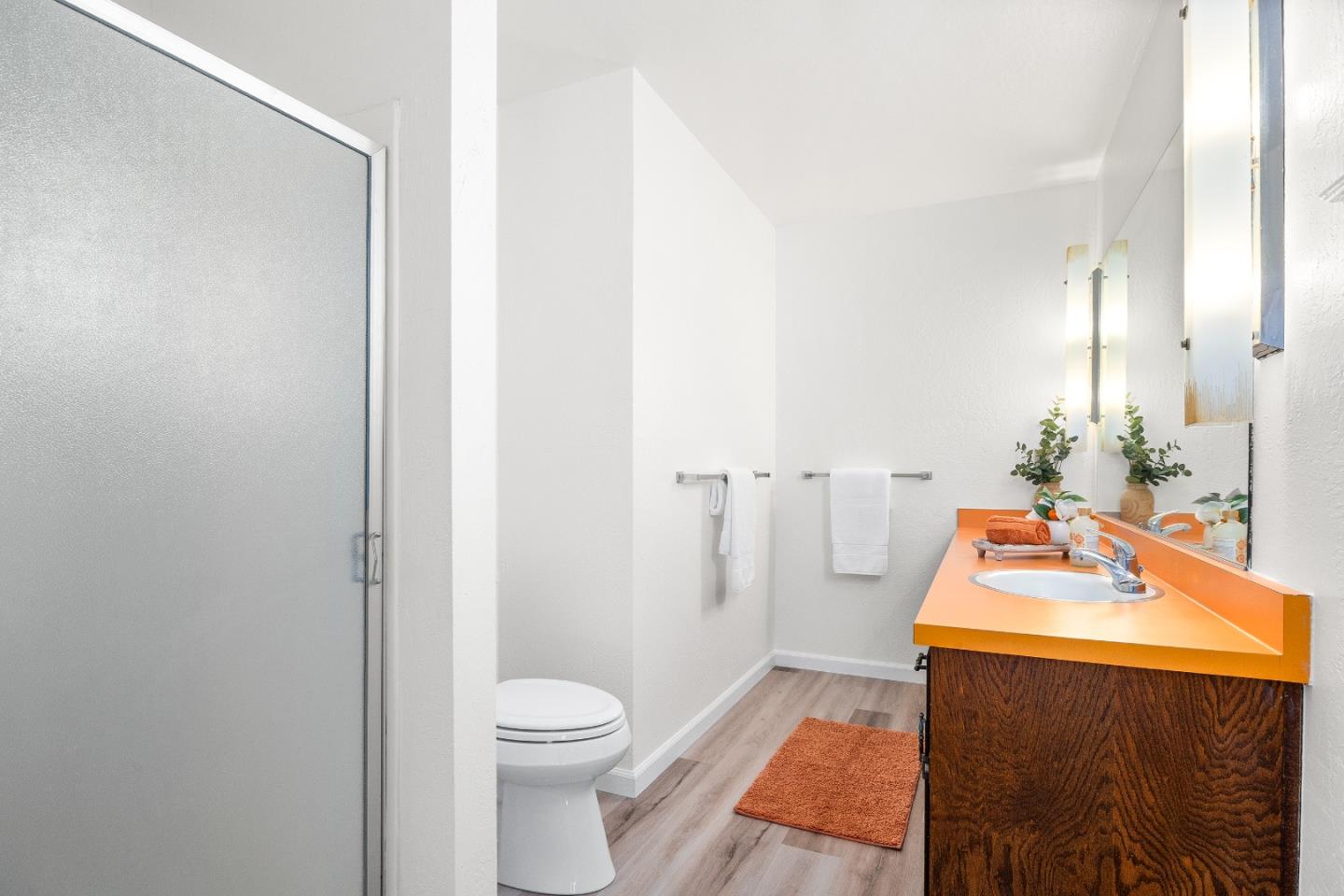 1130 Hidden Valley Road Soquel, CA 95073 - Photo 21 of 44 a bathroom with a sink toilet and shower