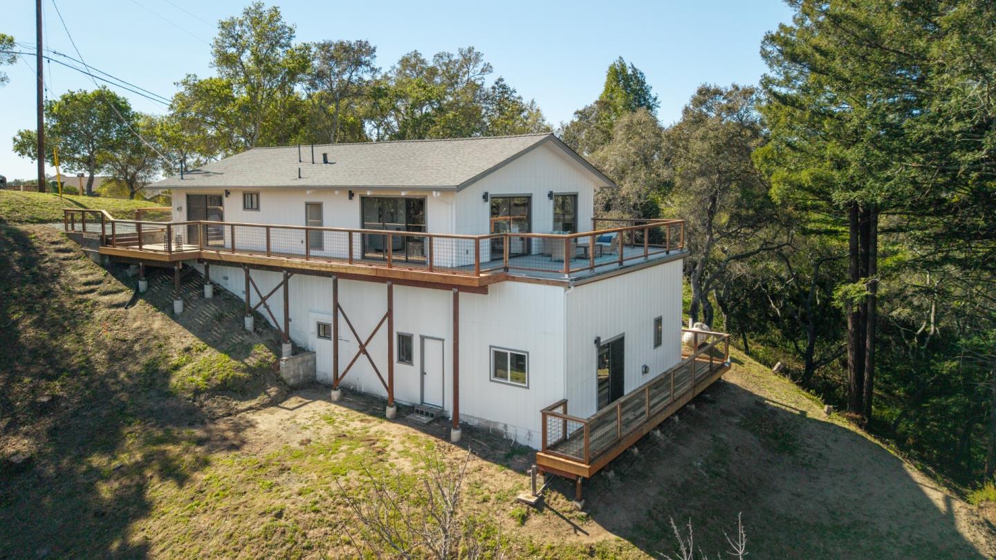 1130 Hidden Valley Road Soquel, CA 95073 - Photo 22 of 44 a view of house with roof deck and iron fence