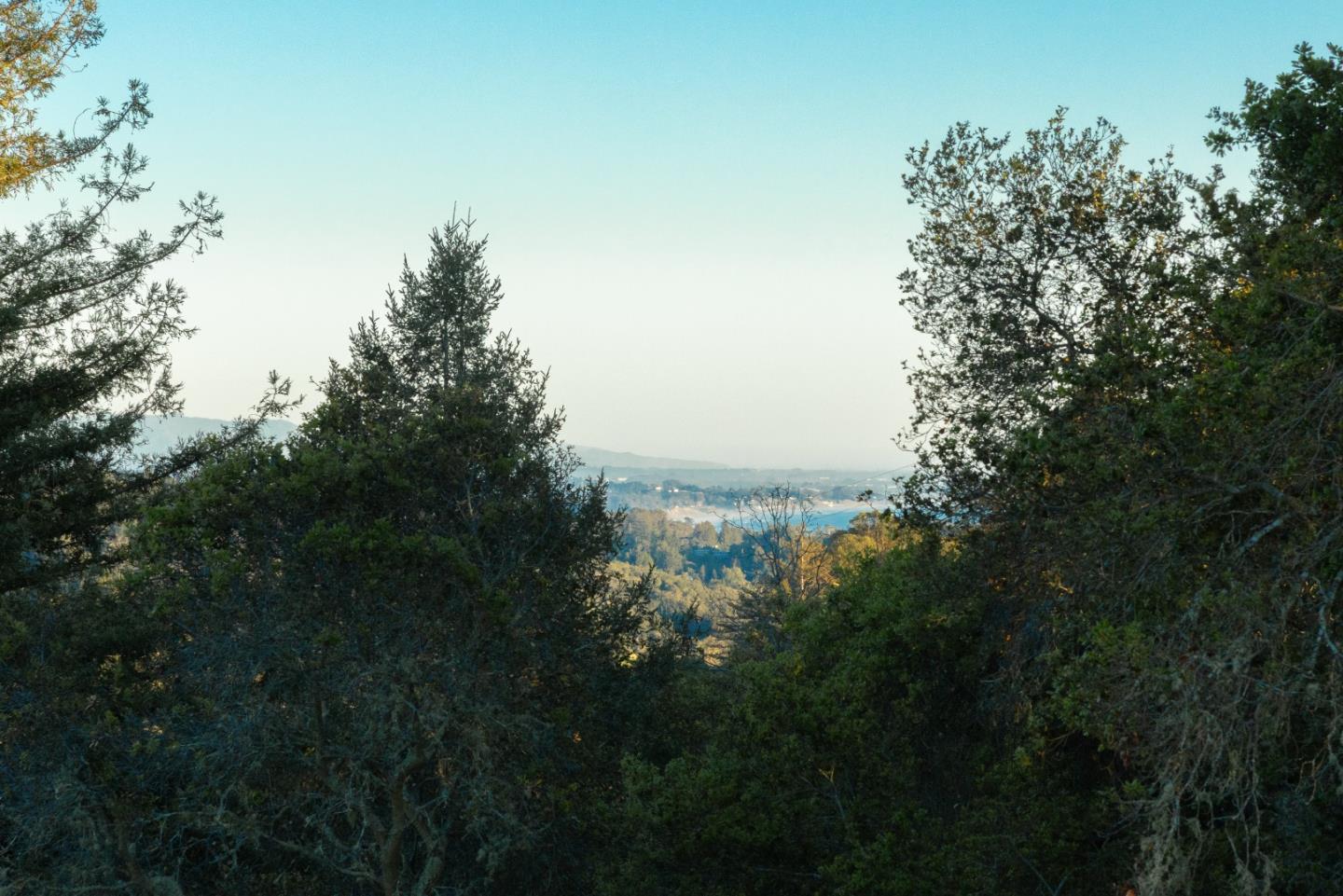 1130 Hidden Valley Road Soquel, CA 95073 - Photo 24 of 44 a view of a lake with a house in background