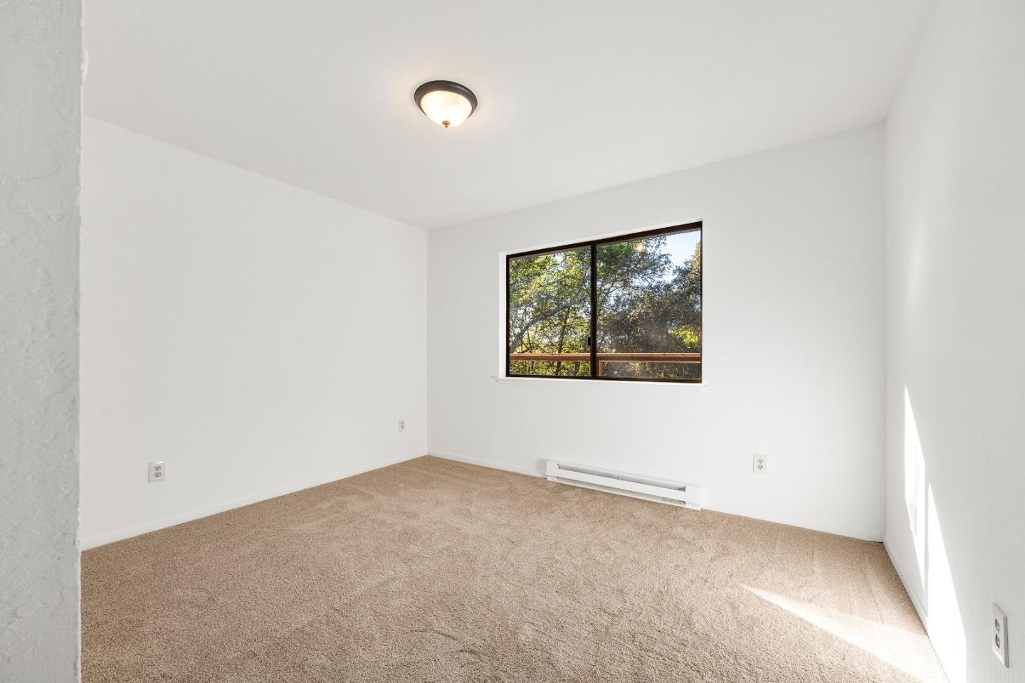 1130 Hidden Valley Road Soquel, CA 95073 - Photo 25 of 44 an empty room with windows