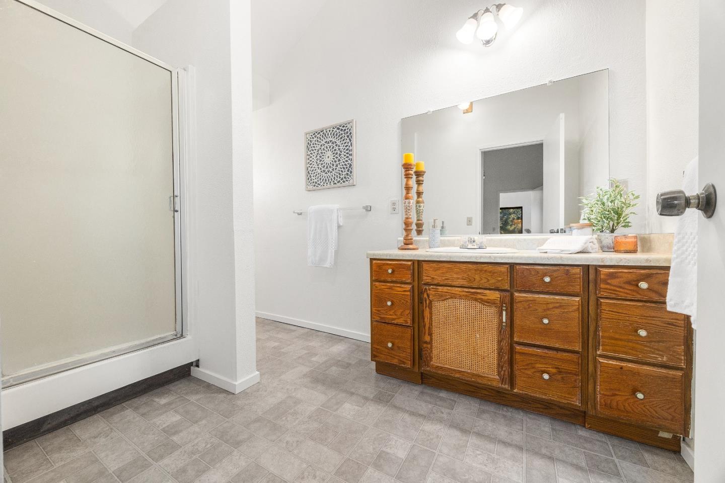 1130 Hidden Valley Road Soquel, CA 95073 - Photo 30 of 44 a bathroom with a sink vanity and mirror