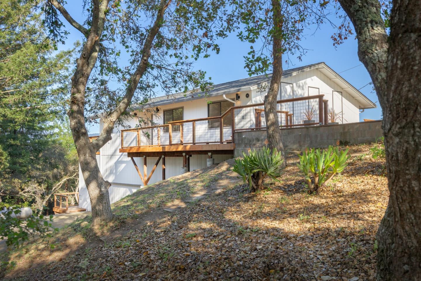1130 Hidden Valley Road Soquel, CA 95073 - Photo 3 of 44 a house that has a tree in front of it