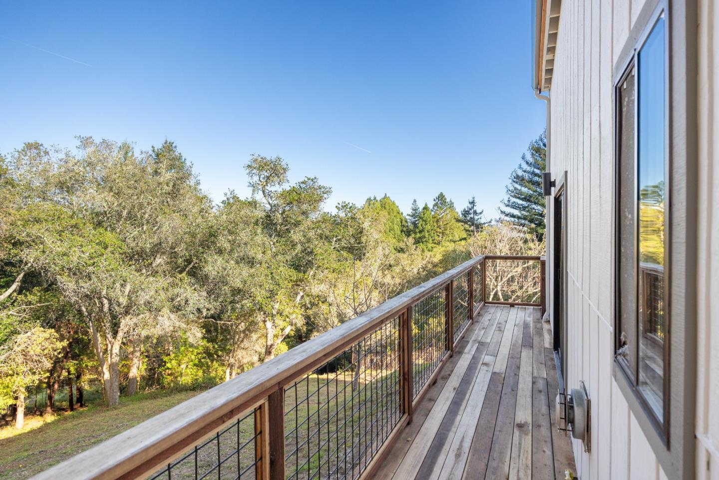 1130 Hidden Valley Road Soquel, CA 95073 - Photo 31 of 44 a view of a balcony with wooden floor and fence