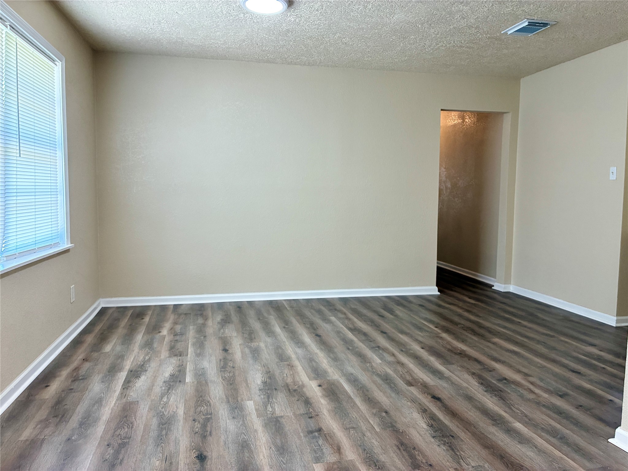 631 Roper Street Houston, TX 77034 - Photo 12 of 15 The large dining room flows into the kitchen and features fresh paint and new vinyl plank flooring.