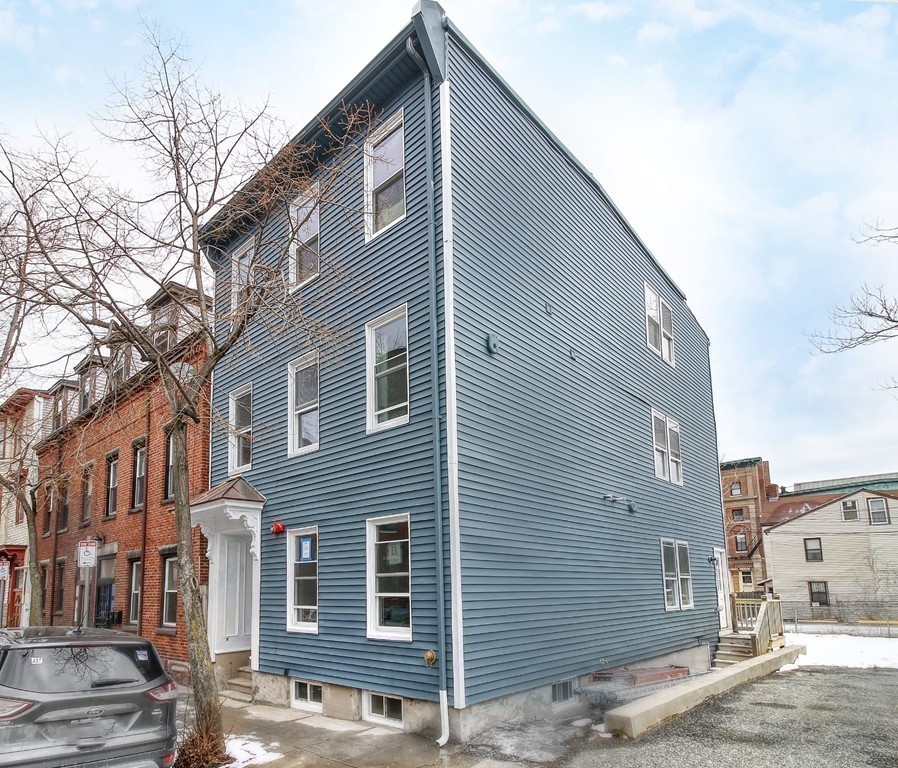 51 Havre Street, Unit 1 Boston, MA 02128 - Photo 9 of 10 a front view of a house with street