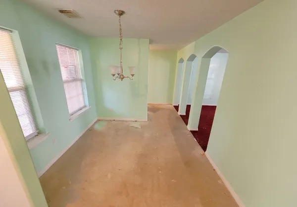 a view of a hallway with windows