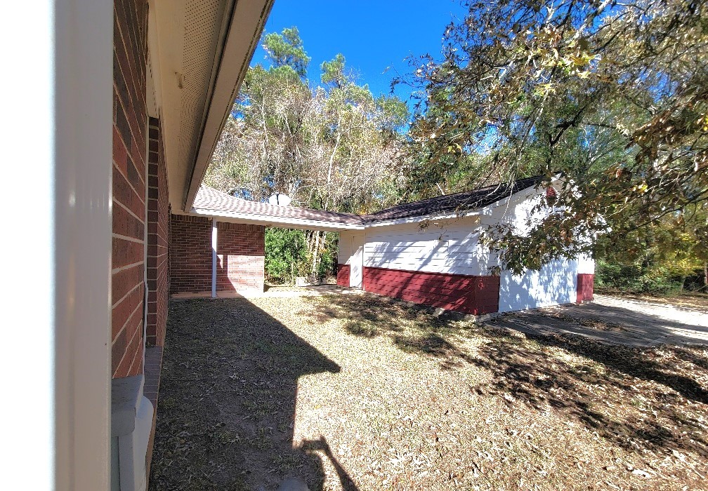1801 Coe Road Pinehurst, TX 77362 - Photo 26 of 26 a view of yard with patio
