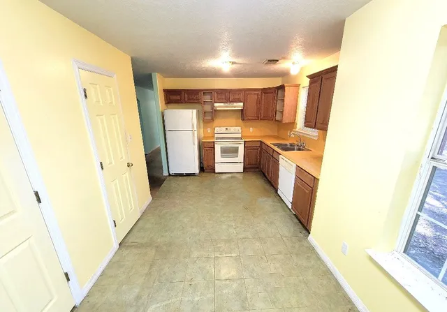 a view of a kitchen with a sink