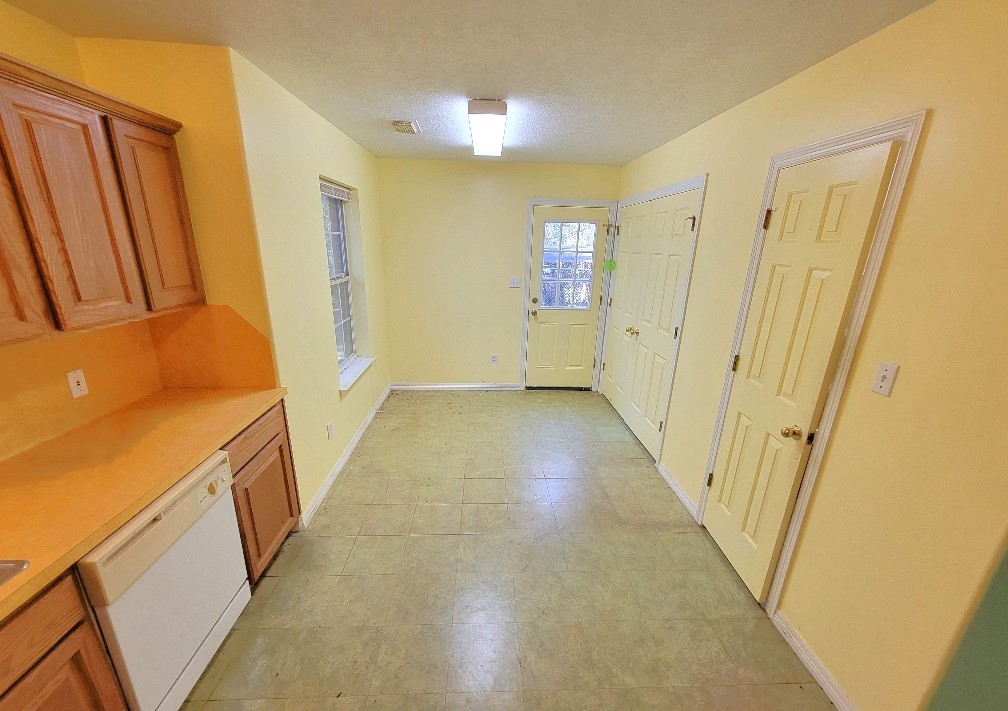 1801 Coe Road Pinehurst, TX 77362 - Photo 8 of 26 a view of a hallway with wooden floor