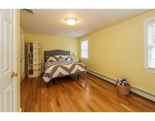 12 Benson Road Rochester, MA 02770 - Photo 19 of 28 a bedroom with a bed and wooden floor